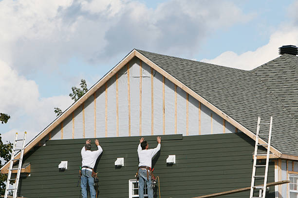 Professional Vinyl Siding technician working in Charlestown, MA